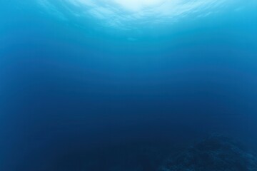 Underwater scene with deep blue hues and soft light.
