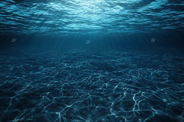 Fototapeta premium Underwater scene with light rays and rippling water.