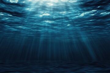 Obraz premium Underwater scene with light rays penetrating the surface.