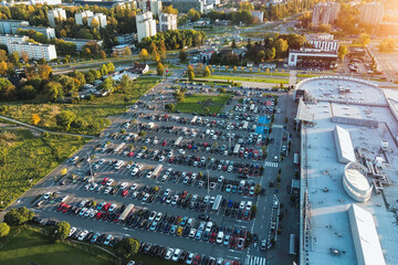 Drone shot of parking lot beside shopping center