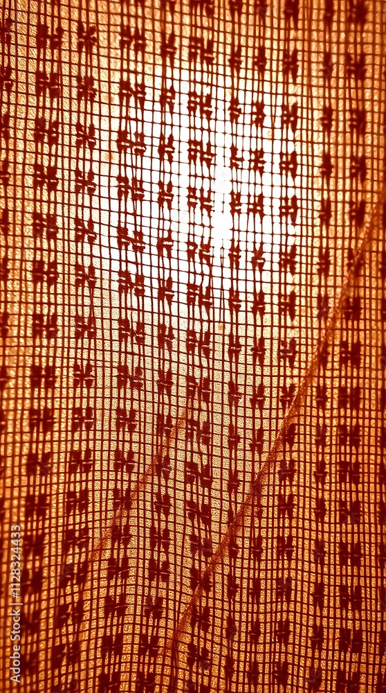 Poster close view of patterned fabric illuminated by soft natural light