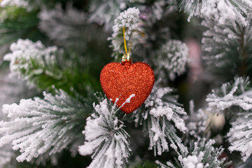 Fototapeta premium Red Heart Shaped Christmas Tree Ornament