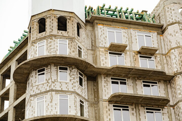 Construction of a Modern Multi-Story Building With a Unique Architectural Design in an Urban Area During Daylight Hours