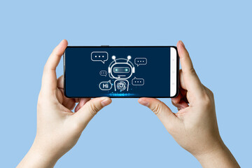 Close-up view of hand using online chat with robot on smartphone for online customer service by intelligent digital AI Chatbot application.