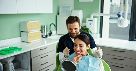 Happy man, dentist or patient with mirror for dental surgery, teeth cleaning or tooth implant at...