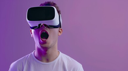 A young man wearing opaque virtual reality goggles, showing amazement