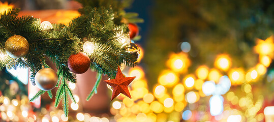 Christmas market background with Christmas tree with decoration and lights. Merry Christmas,...