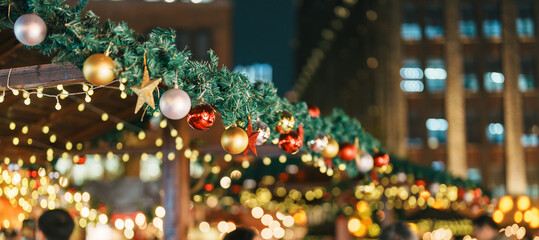 Christmas market background with Christmas tree with decoration and lights. Merry Christmas, holiday and happy New Year concept