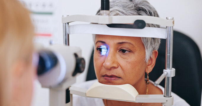 Eye exam, consulting and light with old woman in clinic for optometrist, healthcare and vision. Medical, ophthalmologist and slit lamp with people and equipment for retina, test and assessment