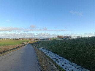 Completed road in Motiekaicio street. New road in Siaulai. Finished road in suburbs. Fields at side. Baigta gatve Motiekaicio gatveje Siauliuose.