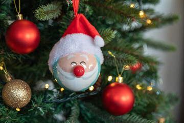 Christmas tree decoration with Santa Claus, on green background