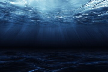 Dark underwater scene with light rays and waves.