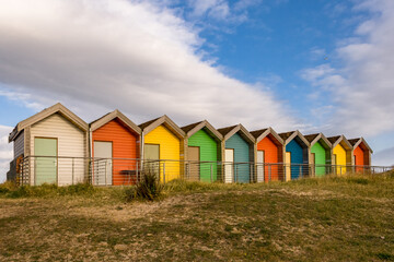 A row of colourful beach huts in Blyth, UK