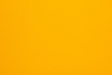 A yellow background with a white dot in the middle