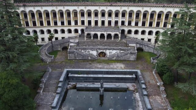 Aerial approaches elegant front entry of abandoned sanatorium Gornika