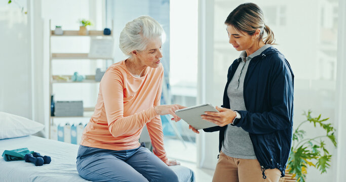 Physiotherapist, senior woman and tablet for talking at clinic with report, progress and consulting for recovery. People, doctor and patient with digital touchscreen, reading and results at hospital