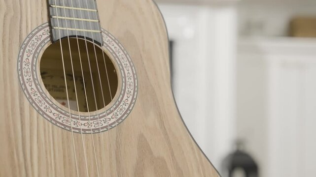 Close up of a classical guitar in a home