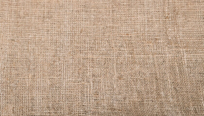 A photograph showcasing natural burlap fabric, highlighting its coarse texture and woven design. Ideal for backgrounds, crafting themes, or rustic design projects.