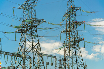 High voltage towers with sky background. Power line support with wires for electricity...
