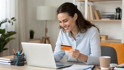 Happy office manager shopping online, browsing web stores, buying annual mobile app membership spending her salary holding orange credit card in hand
