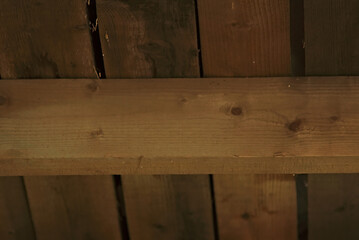 Wooden log and boards lying on it.