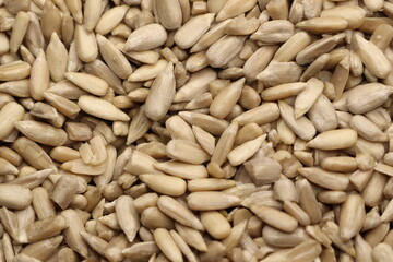 A CloseUp View of Shelled Sunflower Seeds Displayed on a Beautiful Wooden Surface