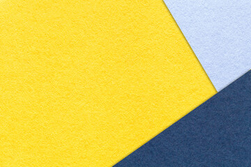Texture craft yellow paper background with sky and navy blue border. Vintage abstract golden cardboard.