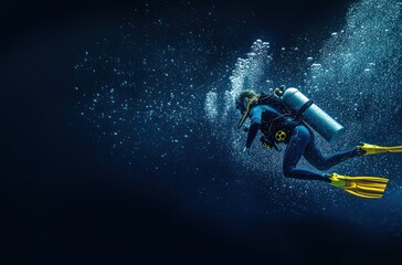 Scuba diver diving in the deep blue ocean, side view. The scuba diver is wearing a wetsuit and yellow flippers on their feet. They have a white air tank behind their back with bubbles coming out of it