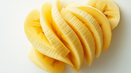 Freshly sliced yellow bananas arranged artfully on a white background for a healthy snack option or dessert. Generative AI