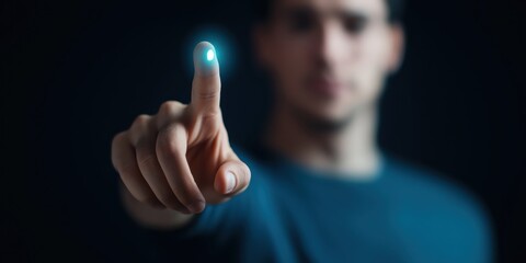 This image portrays a focused individual pointing with futuristic light effects, symbolizing innovation and technology in an engaging and thought-provoking manner.