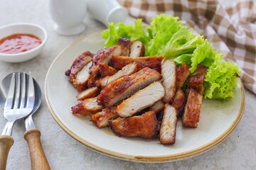 Homemade fried pork in ceramic plate on grey background