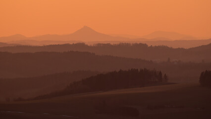 Colorful sunset in the Krkonoše foothills, Zvíčina, Czech Republic.
