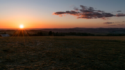 Colorful sunset in the Krkonoše foothills, Zvíčina, Czech Republic.