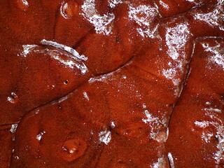 The liquid texture of brown sugar resulting from boiling palm sap. very good as a background