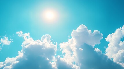 Blue sky with soft white clouds and sunlight creating a cheerful and natural ambiance