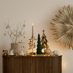Elegant holiday decor with gold accents, candlelight, and festive trees. A warm and stylish setup perfect for Christmas celebrations.