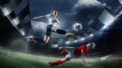 High-action soccer moment featuring female player in white performing powerful kick over player in red. Rainy 3D-modeled stadium. Concept of professional sport, competition, tournament, game