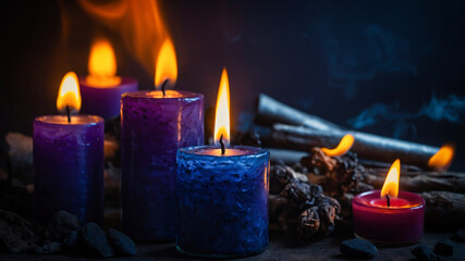 An atmospheric background with a group of lit candles in the dark