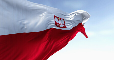 Close-up of Poland national flag waving in the wind on a clear day