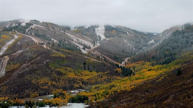 Park City Canyons Village Vail Olympic ski Resort Utah USA aerial drone autumn winter fall autumn vibrant Aspen Tree colors first snow cloudy snowing misty cold Woodward Heber City Base Area Parallax