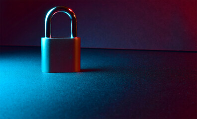 Fototapeta premium General concept of security, in the online environment, payments, in everyday life, represented with a padlock, dark background.