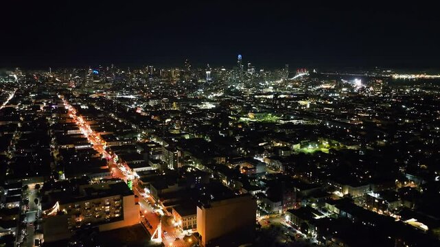 Static drone overview the illuminated skyline of San Francisco, night in USA