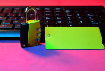 Credit card payments, technological systems, represented with a padlock and card, together with a computer keyboard. Security concept.