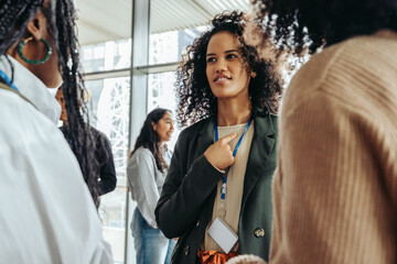 Energetic interaction at a diverse conference where professionals engage in meaningful exchange and...