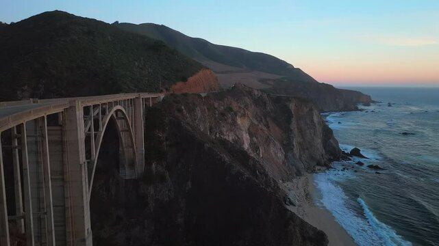 Bixby Bridge Big Creek Pfeiffer Canyon Santa Lucia Mountains Big Sur California aerial drone sunset birds Pacific Ocean Coastal Highway windy road rugged coastline Carmel Sea Monterey static tripod