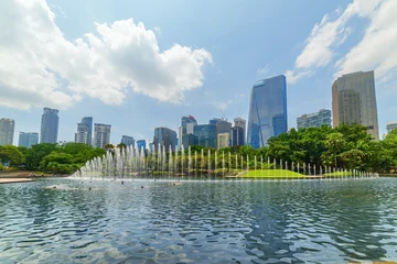 Scenic fountains in a green urban park of Kuala Lumpur