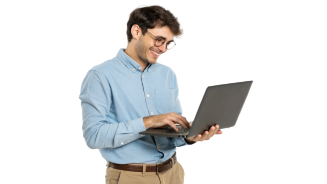 Confident young handsome businessman in blue shirt holding laptop and smiling at camera