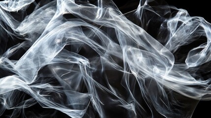 Abstract White Fabric Swirling Against Black Background