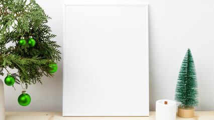 White frame for mockup with thuja branches with Christmas ornaments