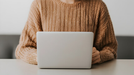 Fototapeta premium A businesswoman working on her laptop at a modern coffee shop, sipping a cappuccino, with soft lighting, and a stylish decor background. Businesswoman working in cozy coffee shop.